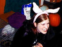 Candace with Holly's bunny and a pumpkin on Halloween.